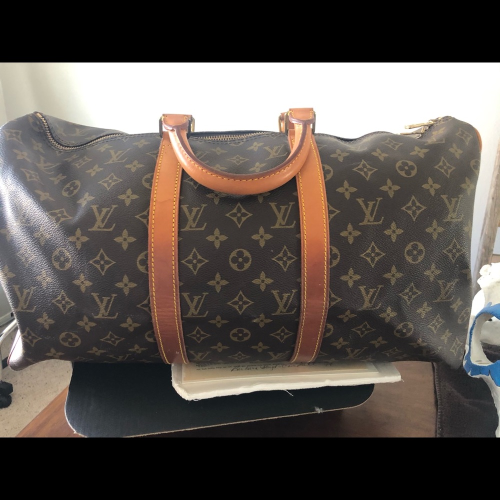 Auth Louis Vuitton overnight duffle bag